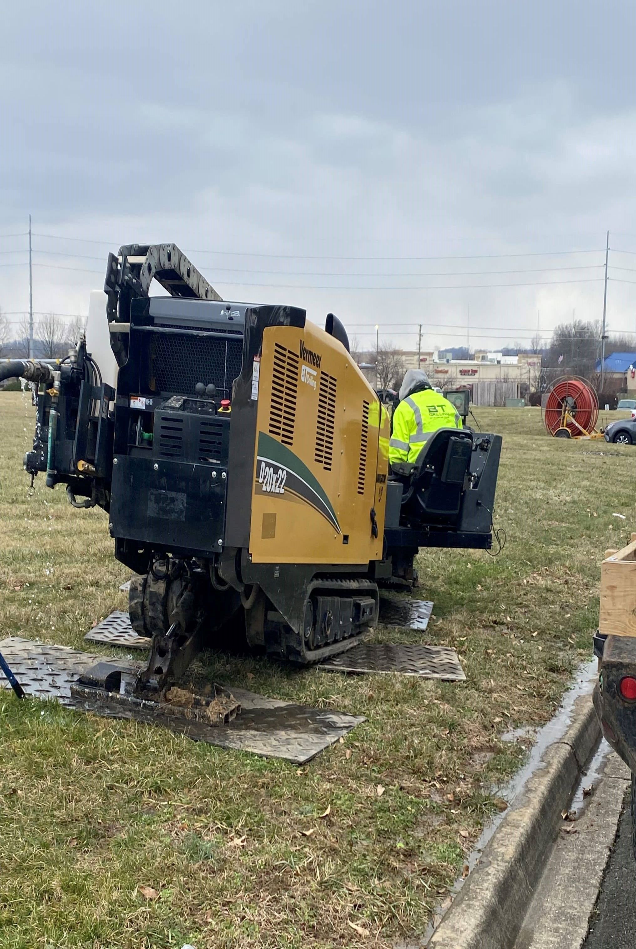 Horizontal Directional drilling team protecting the job site while using industrial digger