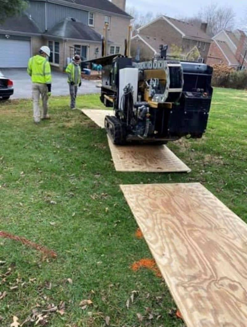 Horizontal Directional drilling team protecting the job site while using industrial digger